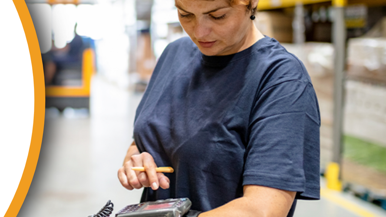 warehouse worker using mobile computer